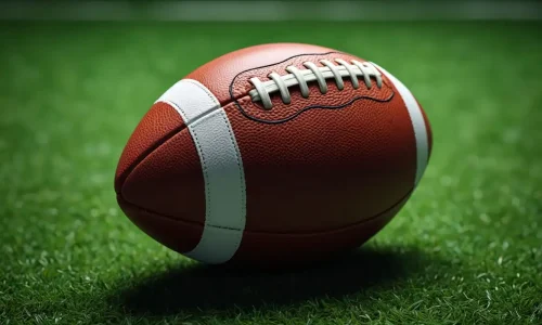 American football ball on turf – sports apparel banner for t-shirts and hoodies